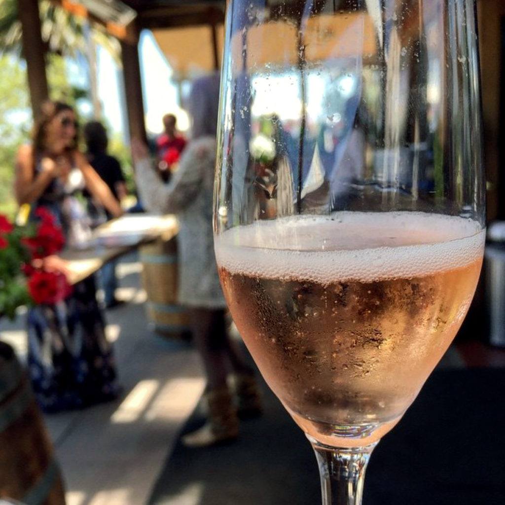 Glass of Wedding Cuvee at a tasting room